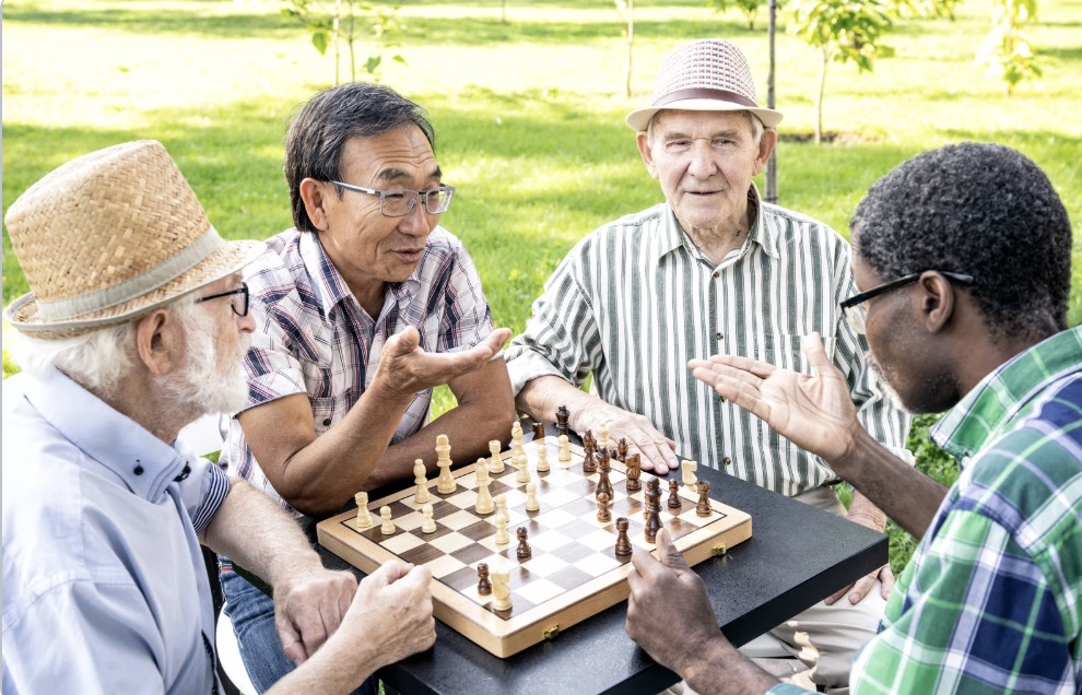 seniors playing chess at a senior living community