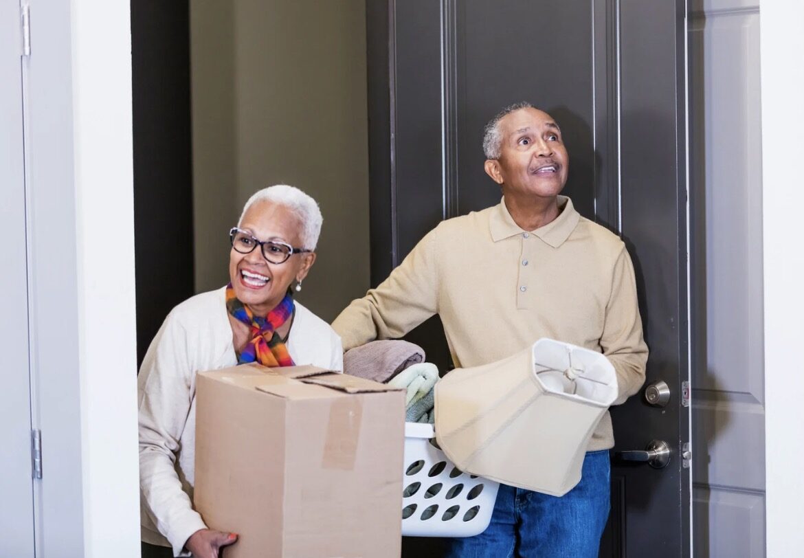 senior couple downsizing for move to a retirement community