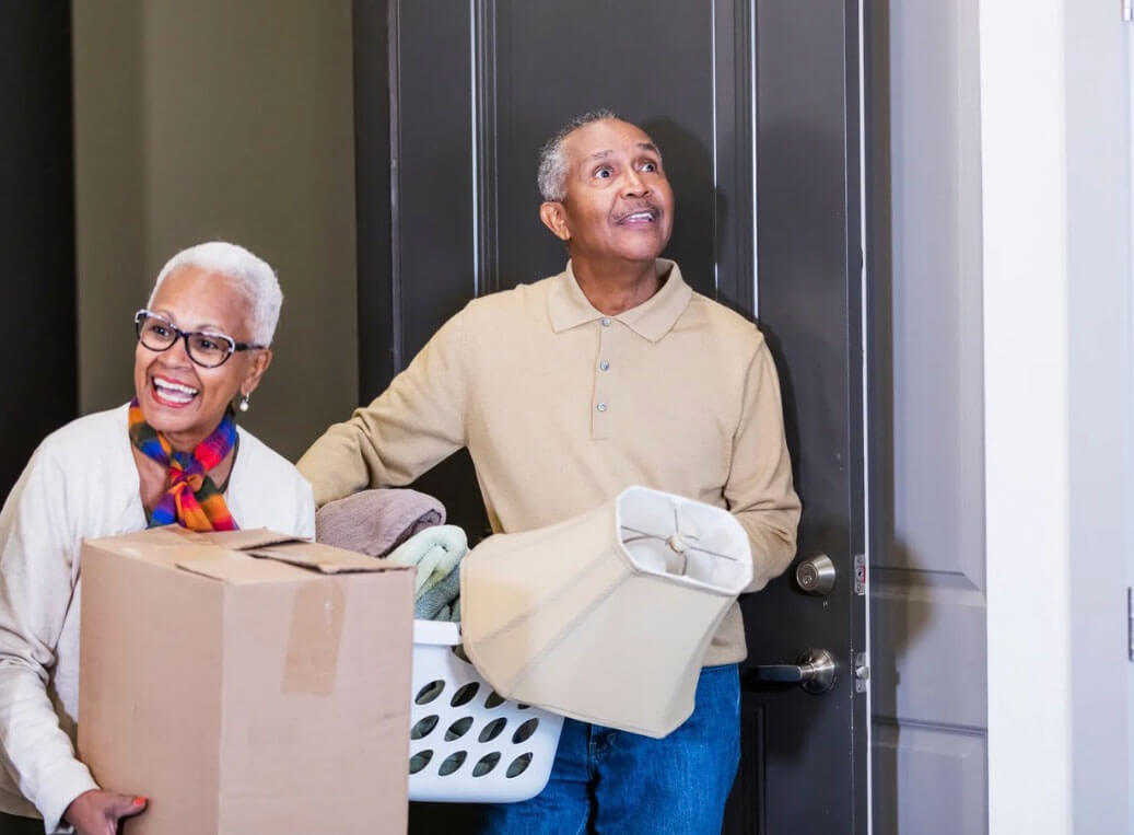 senior couple downsizing for move to a retirement community