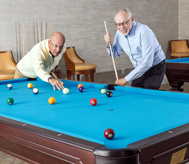Senior Men Playing Billards At Searstone Retirement Community