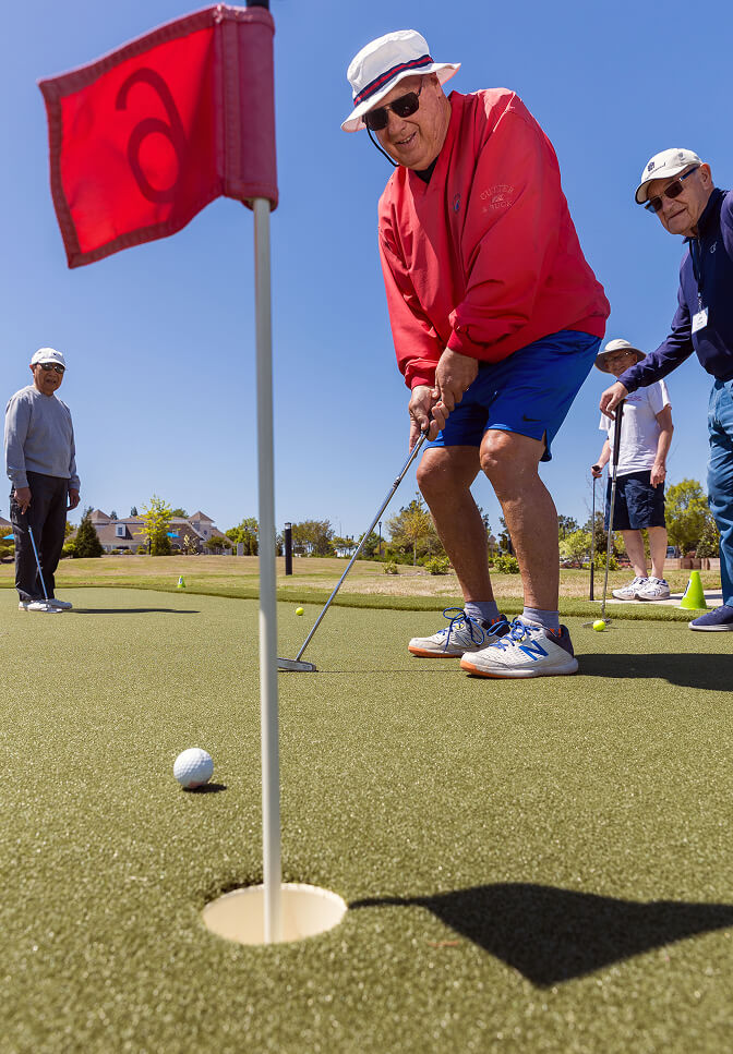 Seniors Playing Golf At Searstone Retirement Community In Cary, North Carolina
