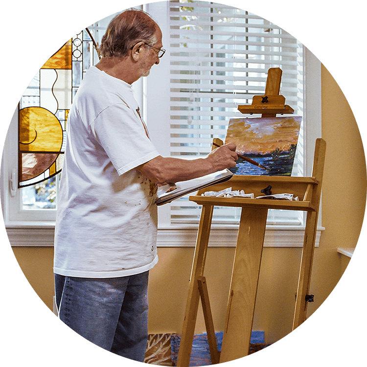 Elderly man painting