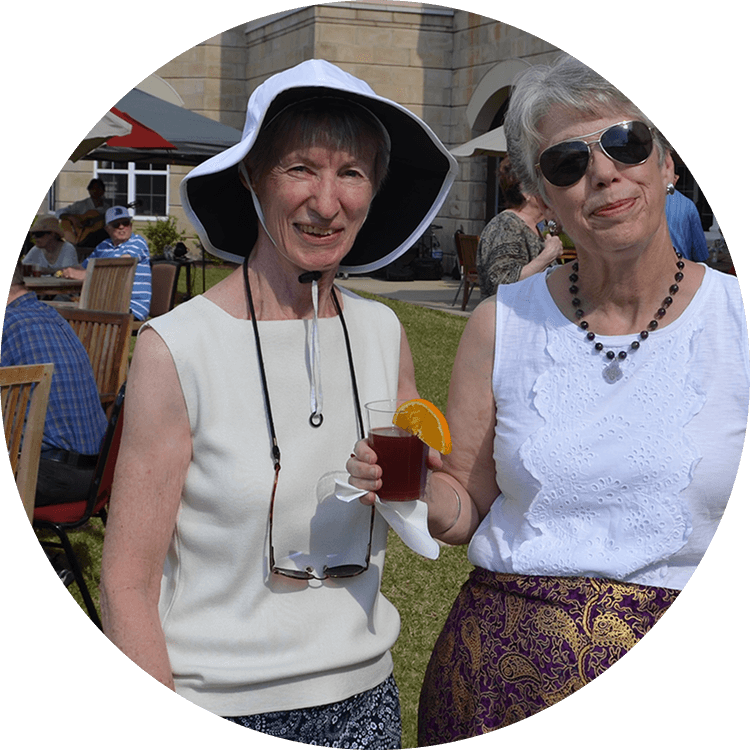 Senior women enjoying adult beverages at a senior living community event