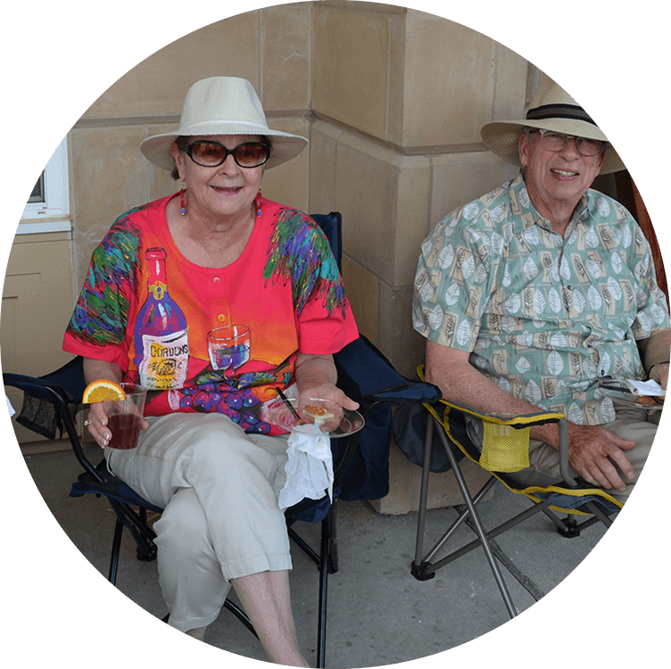 Elderly couple enjoying at patio party at Searstone