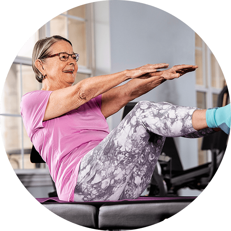 Elderly woman exercising at a life plan community in North Carolina