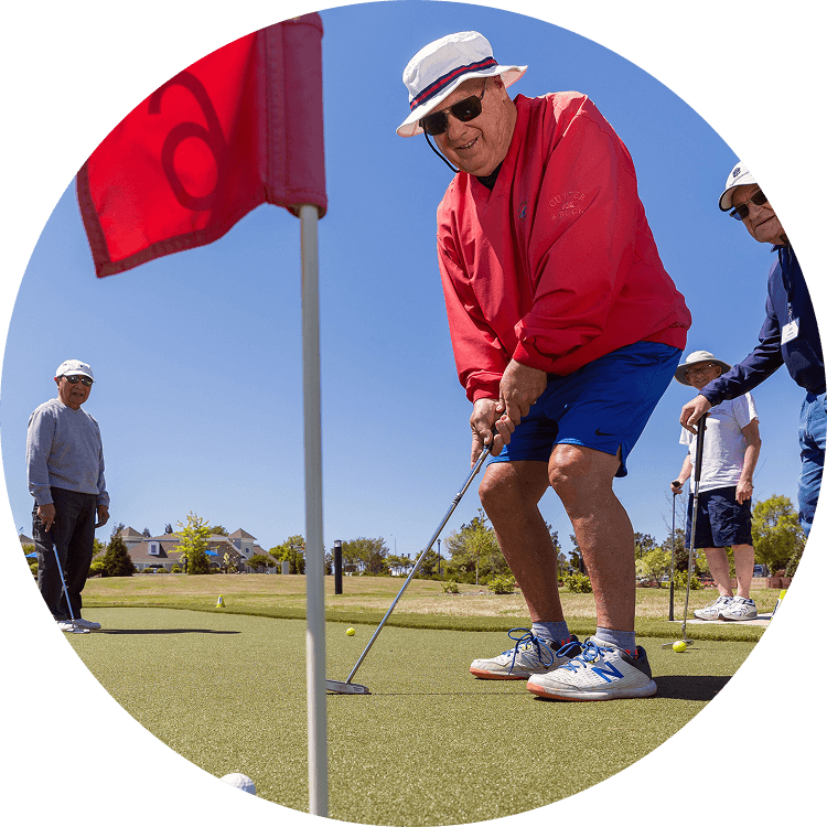Senior men golfing at Searstone Retirement Community