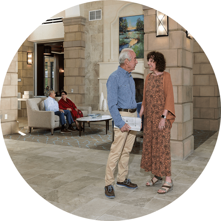 Senior couple socializing in a communal space at Searstone Retirement Community