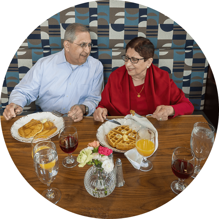 Senior couple enjoying breakfast at a senior living dining venue