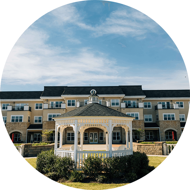 Exterior view of Searstone Retirement Community featuring a gazebo